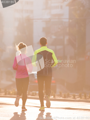 Image of young  couple jogging