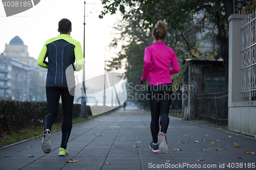 Image of young  couple jogging