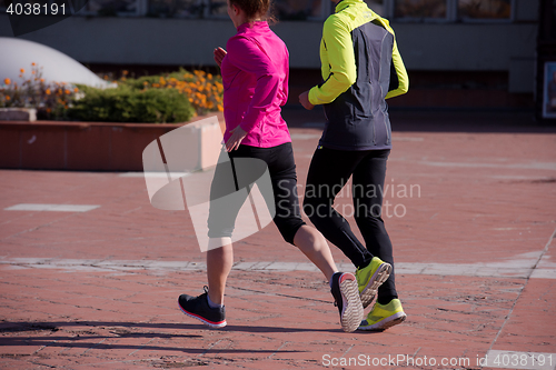 Image of young  couple jogging