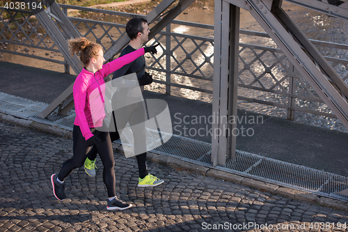 Image of young  couple jogging