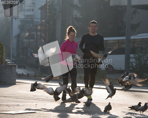 Image of young  couple jogging
