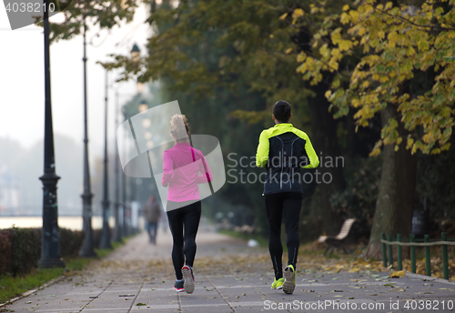 Image of young  couple jogging