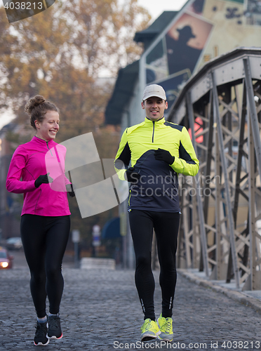 Image of young  couple jogging