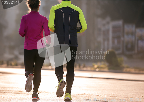 Image of young  couple jogging