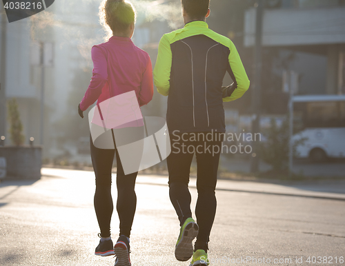 Image of young  couple jogging