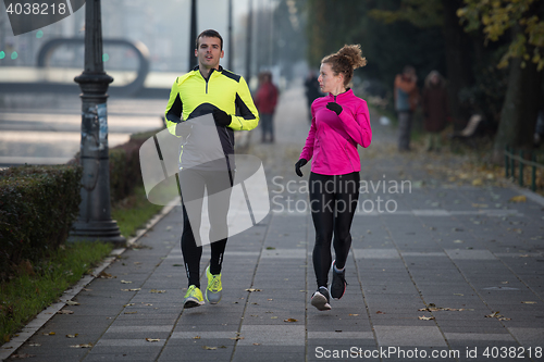 Image of young  couple jogging
