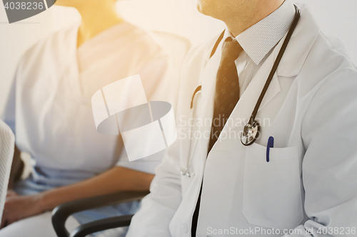 Image of close up of happy doctors at seminar or hospital