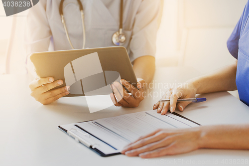 Image of close up of doctors with tablet pc at hospital