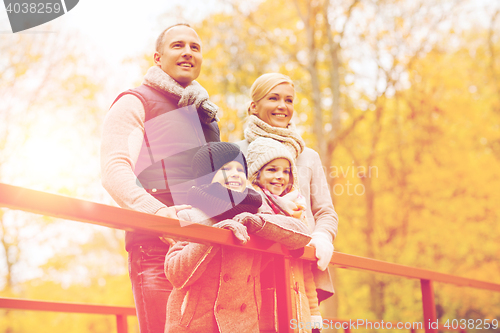 Image of happy family in autumn park