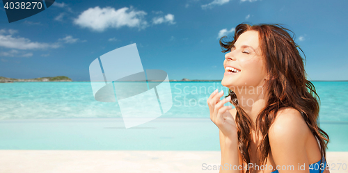 Image of happy beautiful woman on tropical beach