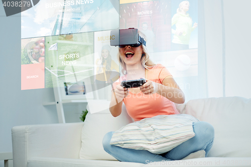 Image of woman in virtual reality headset with controller