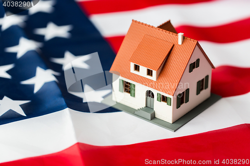 Image of close up of house model on american flag