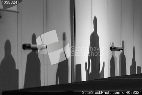 Image of Silhouettes of leaders on a podium.