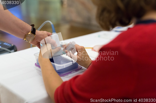 Image of Medical doctor student learning to use ultra sound scanner machine.