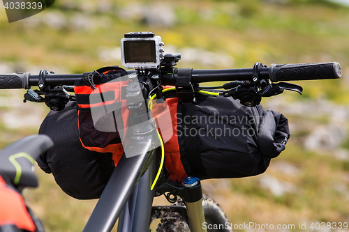 Image of Bicycle with orange bags for travel