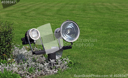 Image of garden lighting and green grass in daylight