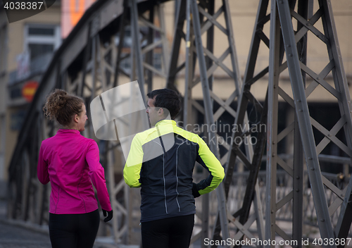 Image of young  couple jogging