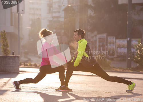 Image of couple warming up before jogging