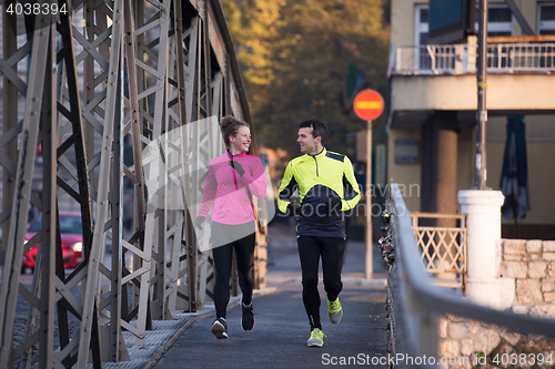 Image of young  couple jogging