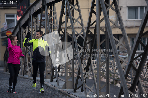 Image of young  couple jogging