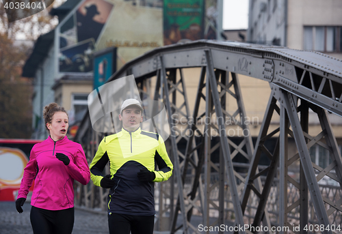 Image of young  couple jogging