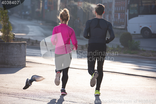 Image of young  couple jogging