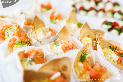 Image of close up of dough cornet with salmon fish filling