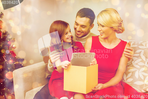 Image of smiling family with tablet pc