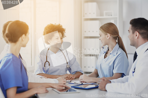 Image of group of happy doctors meeting at hospital office