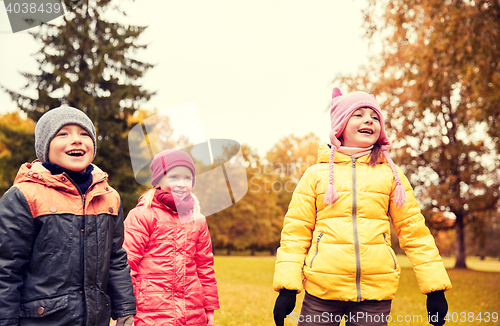 Image of group of happy children in autumn park