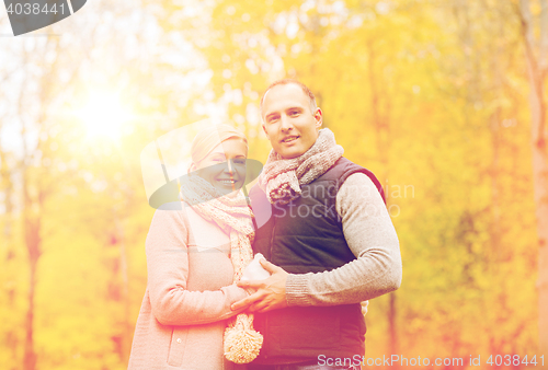 Image of smiling couple in autumn park