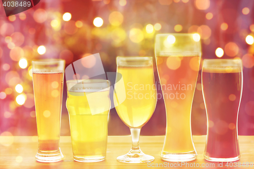 Image of close up of different beers in glasses on table