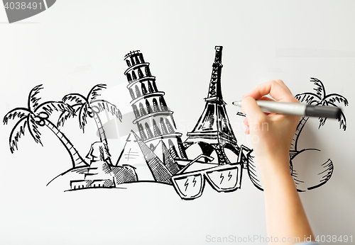 Image of close up of hand drawing touristic landmarks