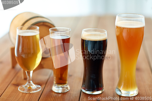 Image of close up of different beers in glasses on table