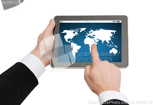 Image of close up of hands holding tablet pc with world map