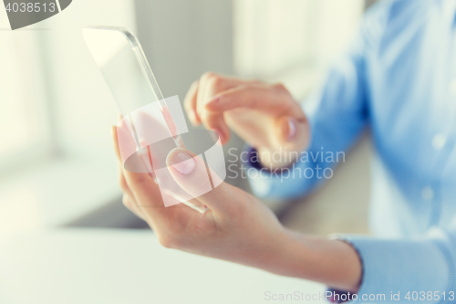 Image of close up of woman with transparent smartphone