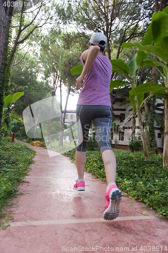 Image of sporty woman jogging