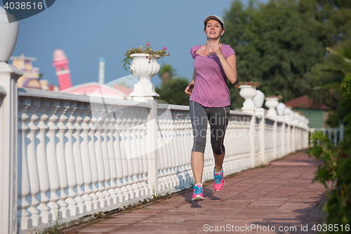 Image of sporty woman jogging