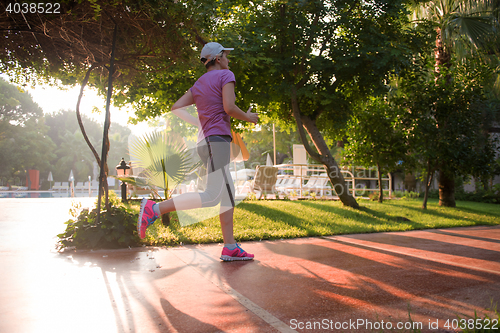 Image of sporty woman jogging