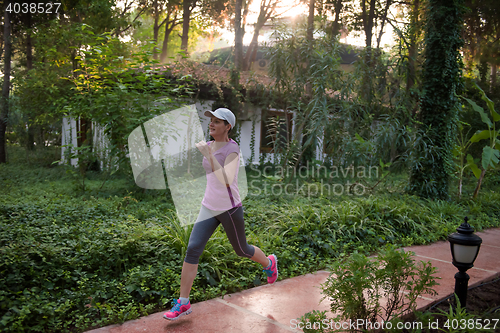 Image of sporty woman jogging