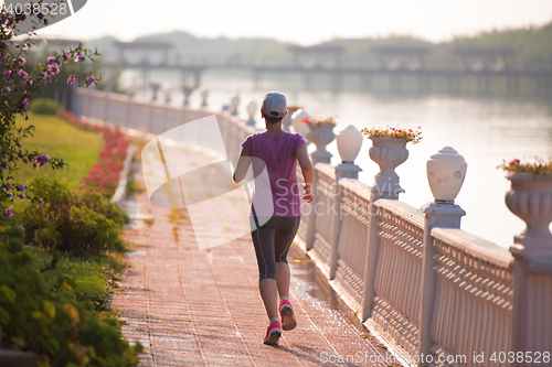 Image of sporty woman jogging