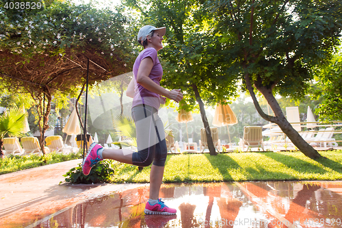 Image of sporty woman jogging