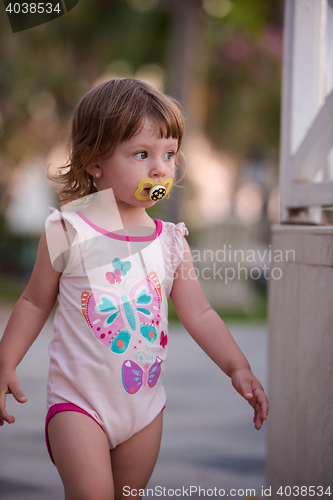 Image of girl and mother walking