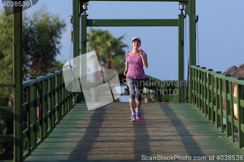 Image of sporty woman jogging