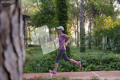 Image of sporty woman jogging