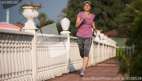 Image of sporty woman jogging