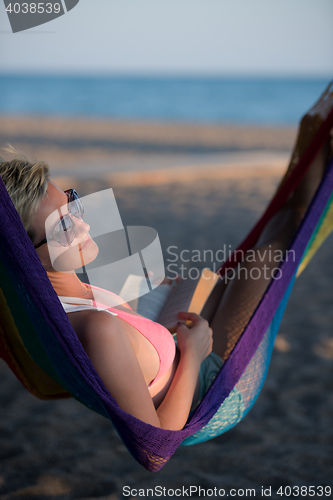 Image of relaxed woman laying in hammock