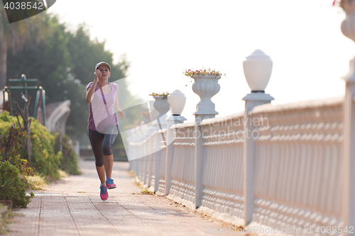 Image of sporty woman jogging