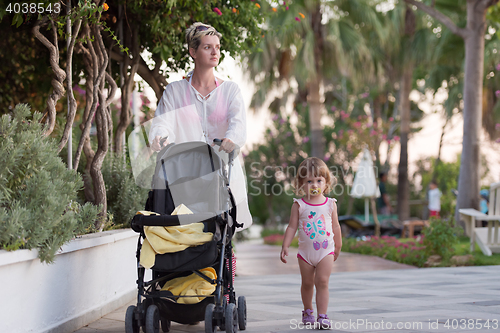 Image of girl and mother walking