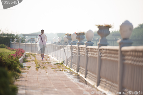 Image of sporty woman jogging